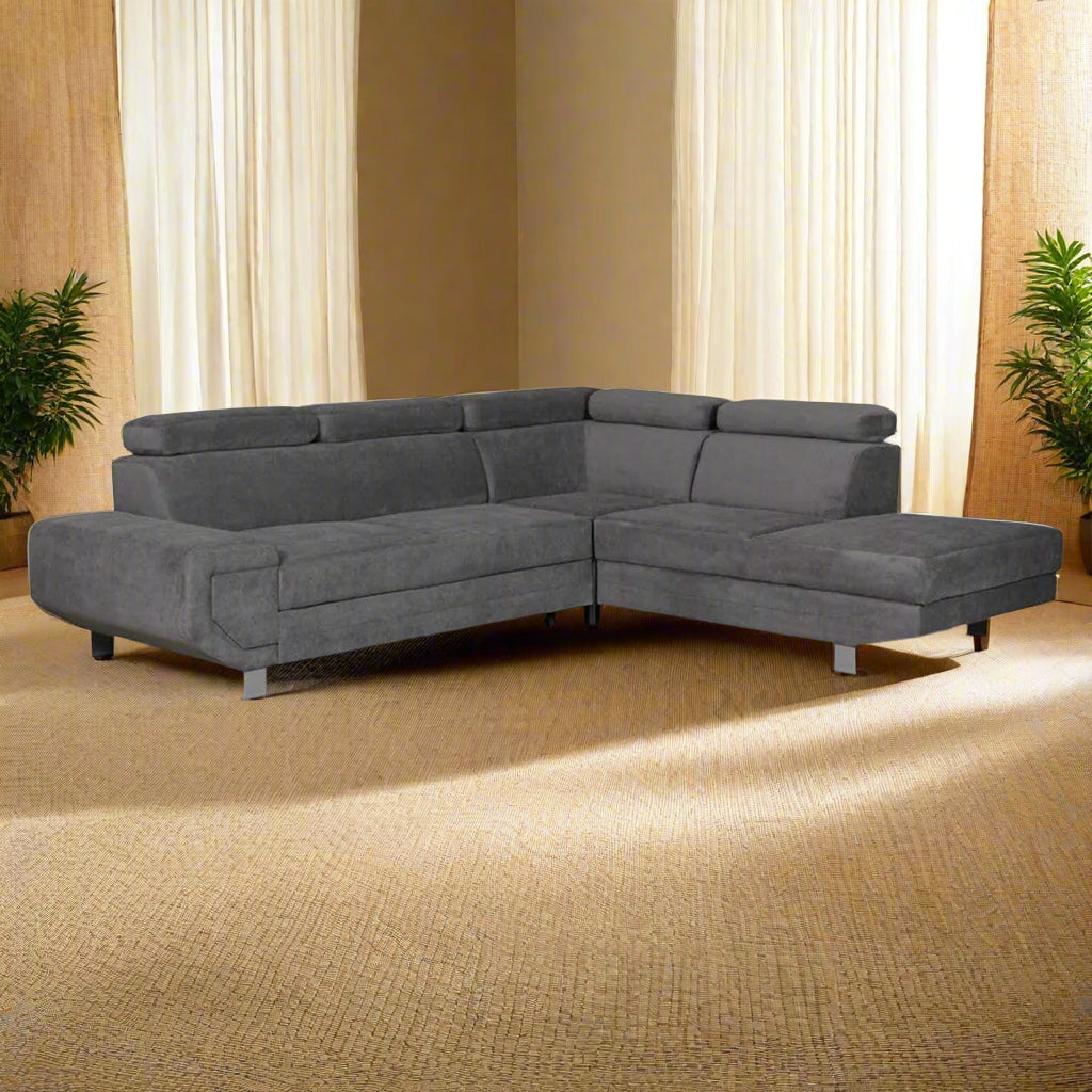 Grey sectional corner sofa bed with storage on a natural carpet