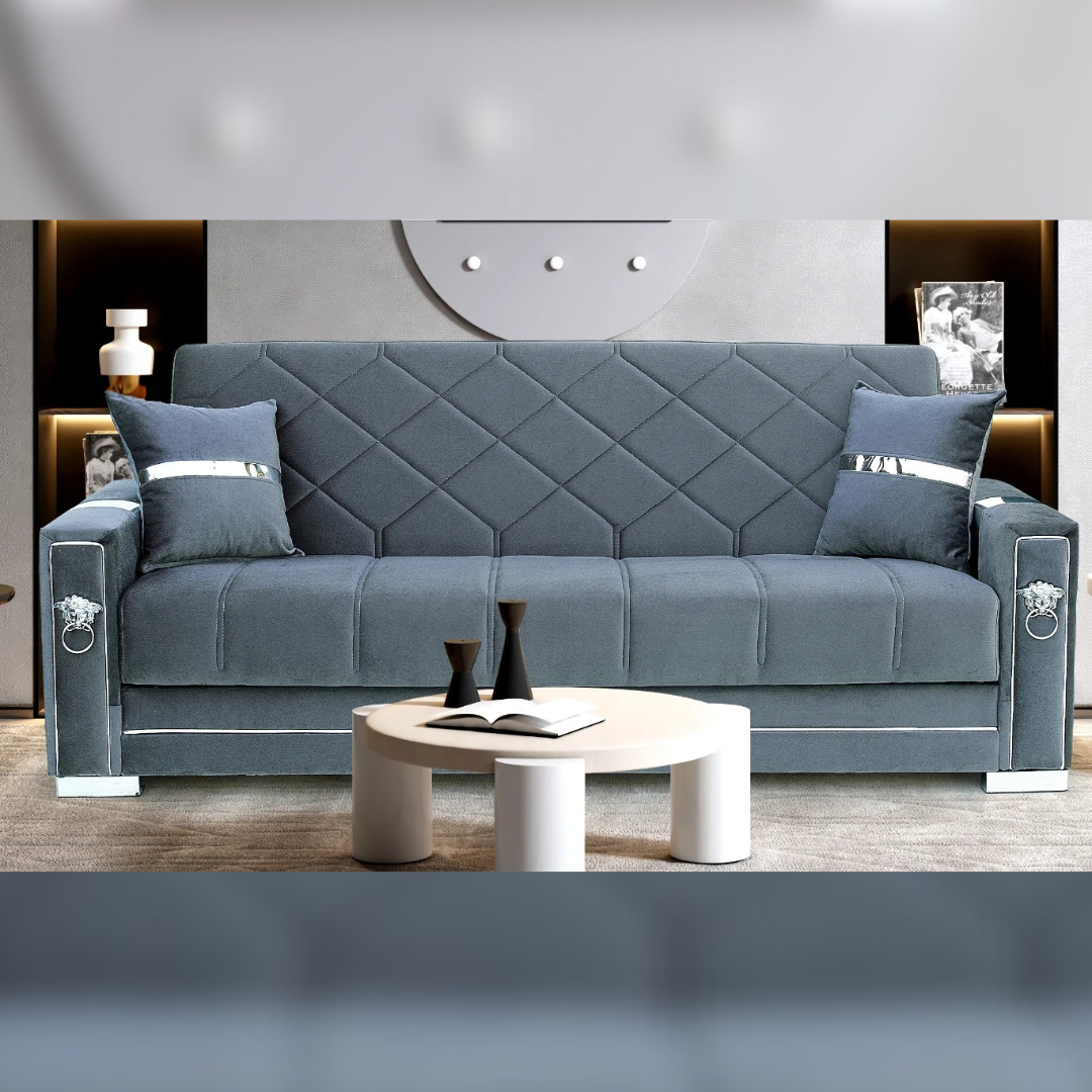 A modern grey 3 seater sofa bed with a unique quilted diamond pattern and contemporary arm style, shown in a living room setting.