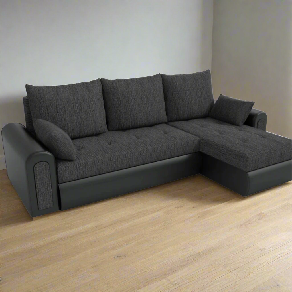 Dark gray l shape couch sofa in a living room.
