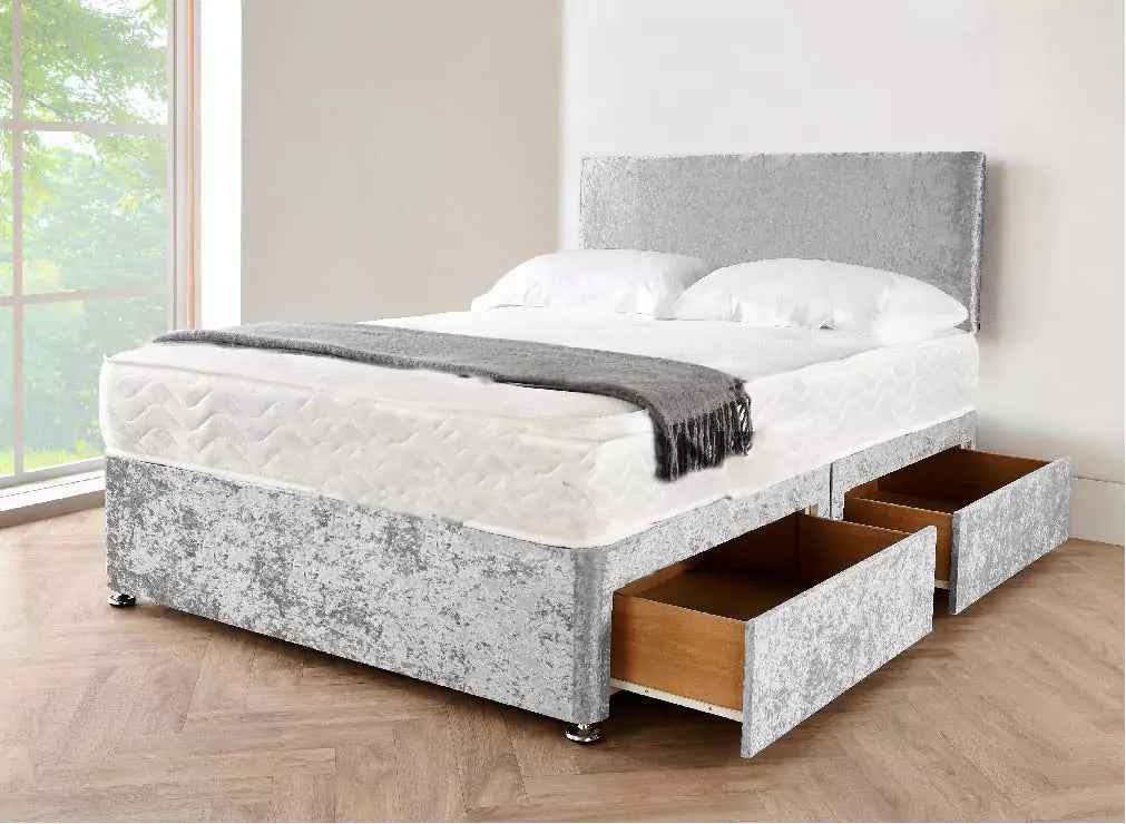 Light grey crushed velvet divan bed with chrome feet, showing the soft fabric texture.