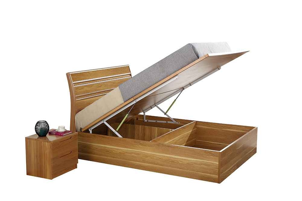 Wooden bed ottoman with storage compartments and a nightstand on a white background
