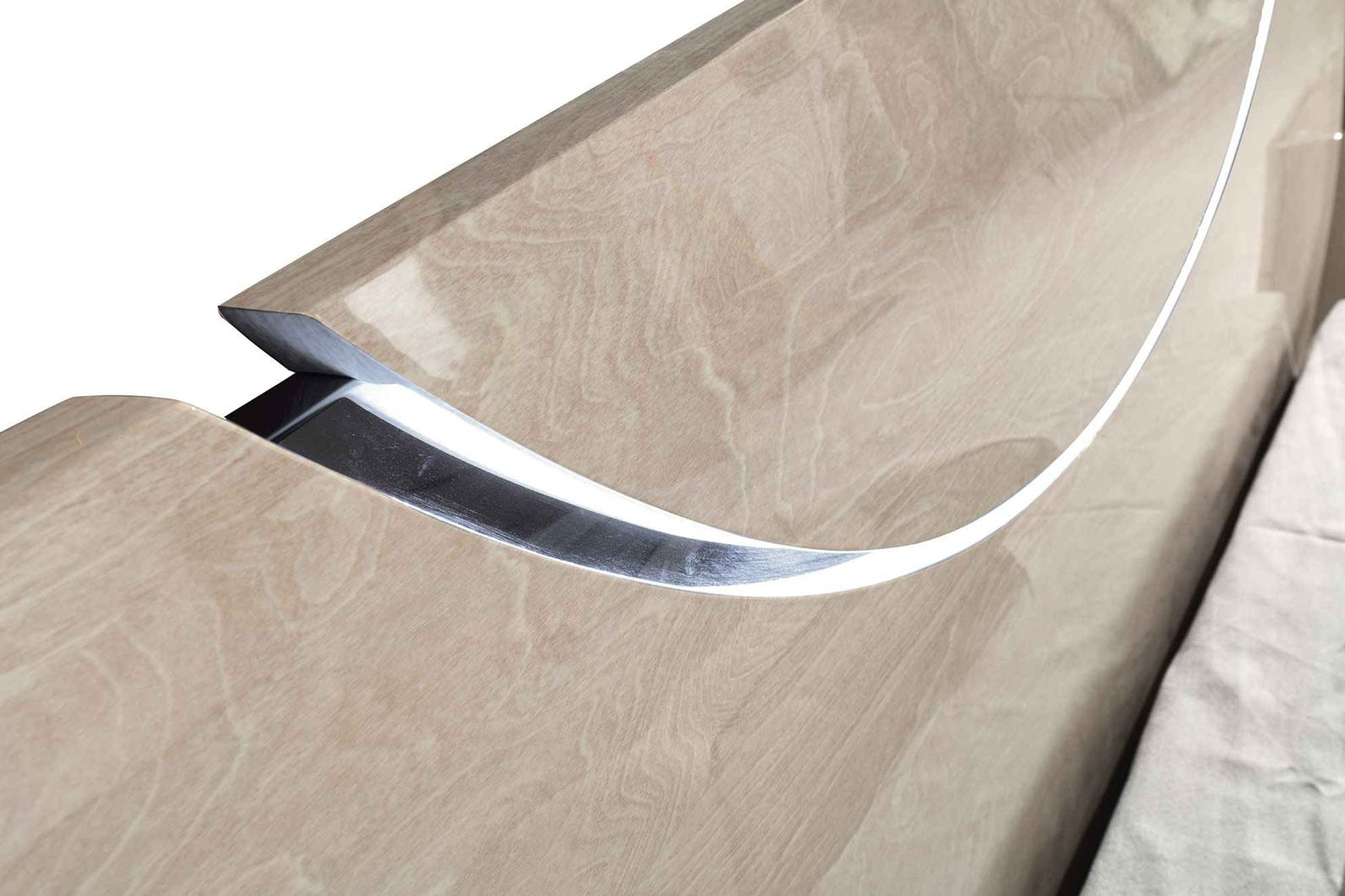 Close-up of the Half Moon bed frame headboard showing the stylish curved cut and active LED light strip