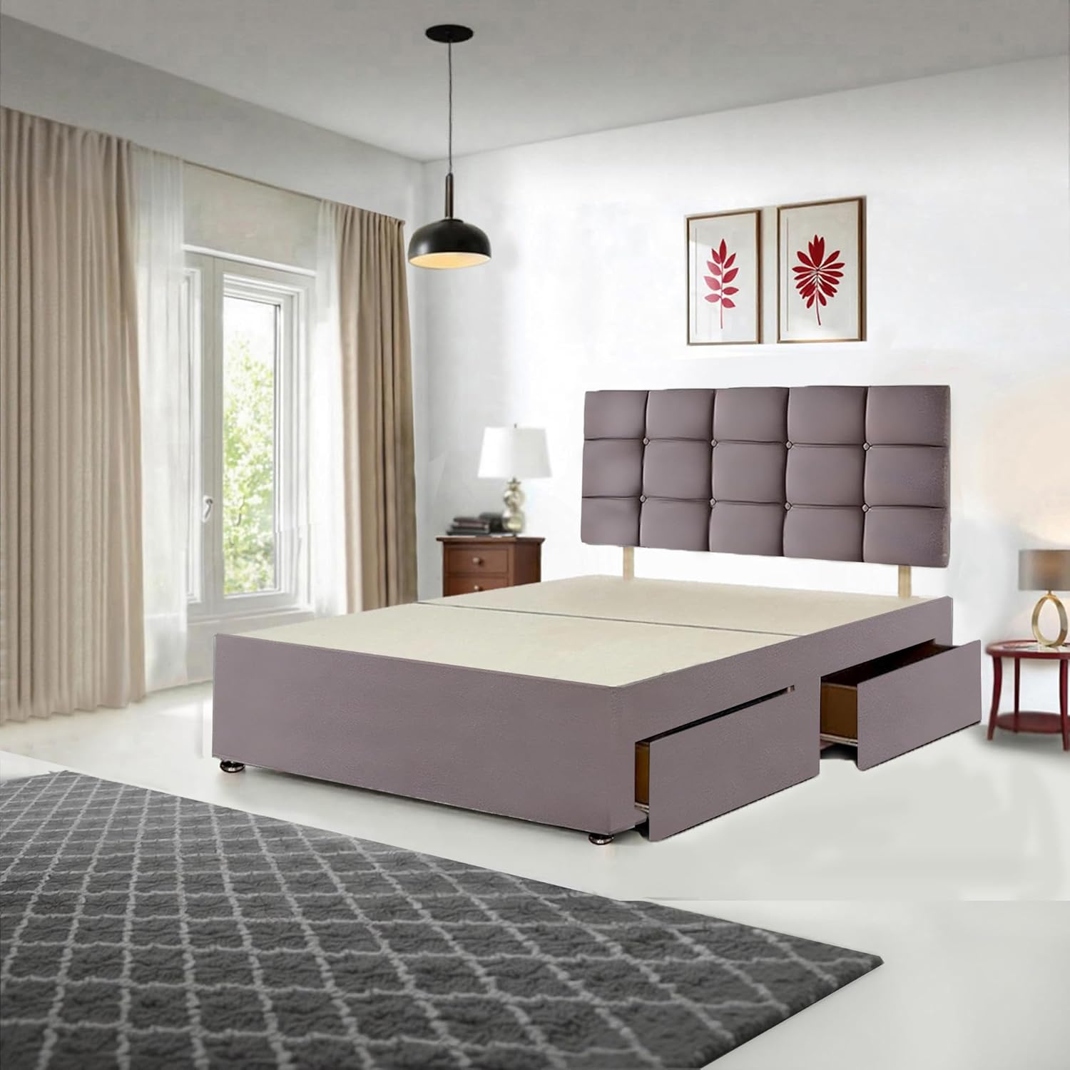 Barcelona Double Divan Bed in grey with a mattress, bedding, and pillows, showcasing a fully dressed bed with open storage drawers.
