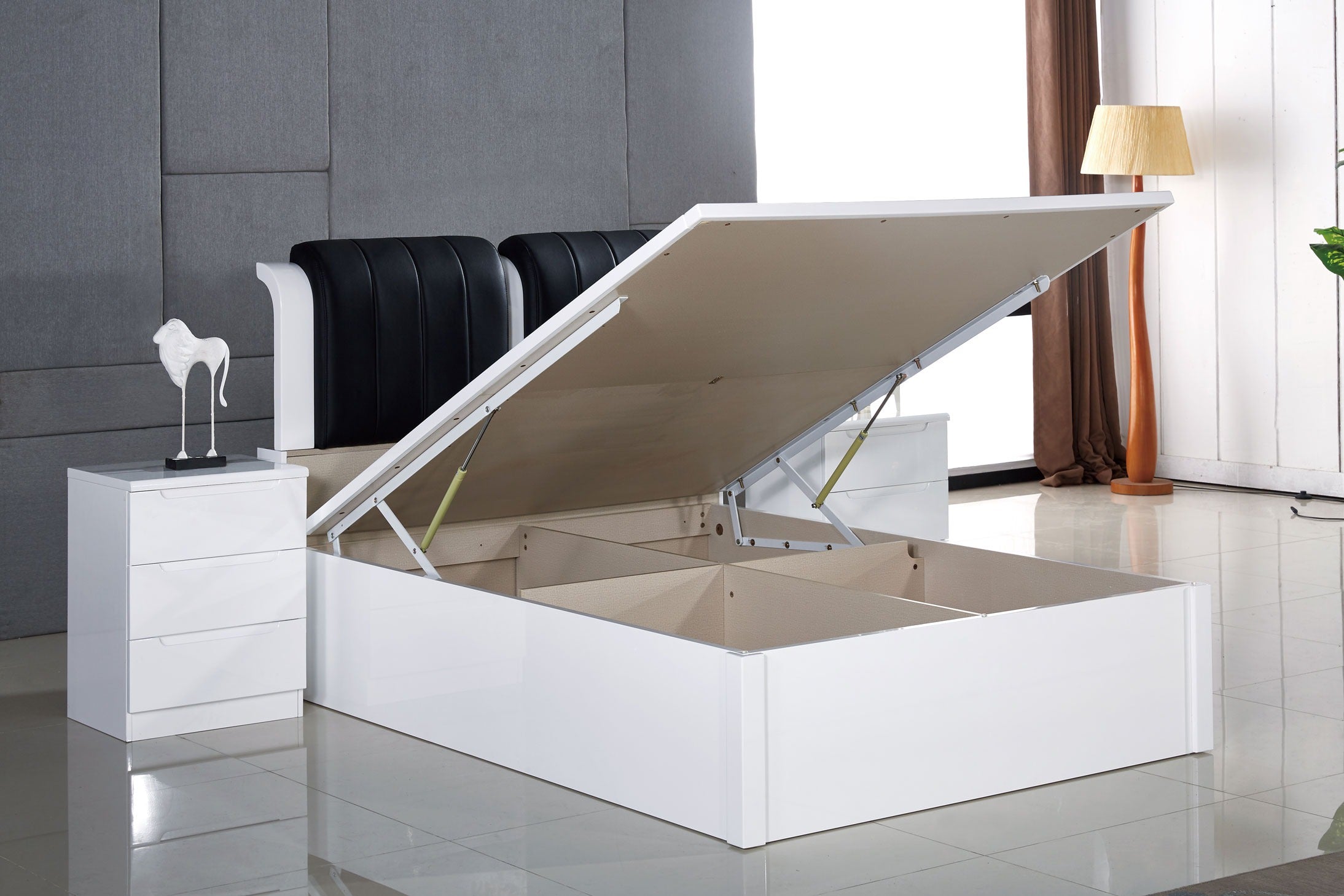 White double ottoman storage bed with open Gas-lift storage in a bedroom setting