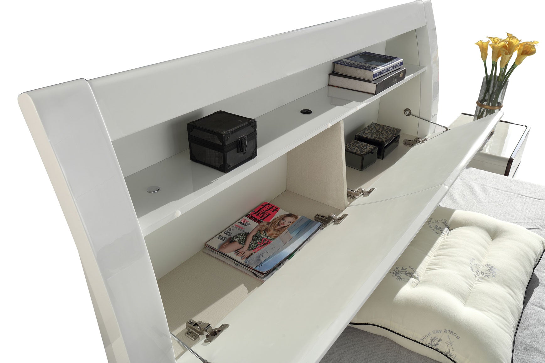 A close-up of the smart bed with LED lights and integrated headboard storage from the white bedroom set.