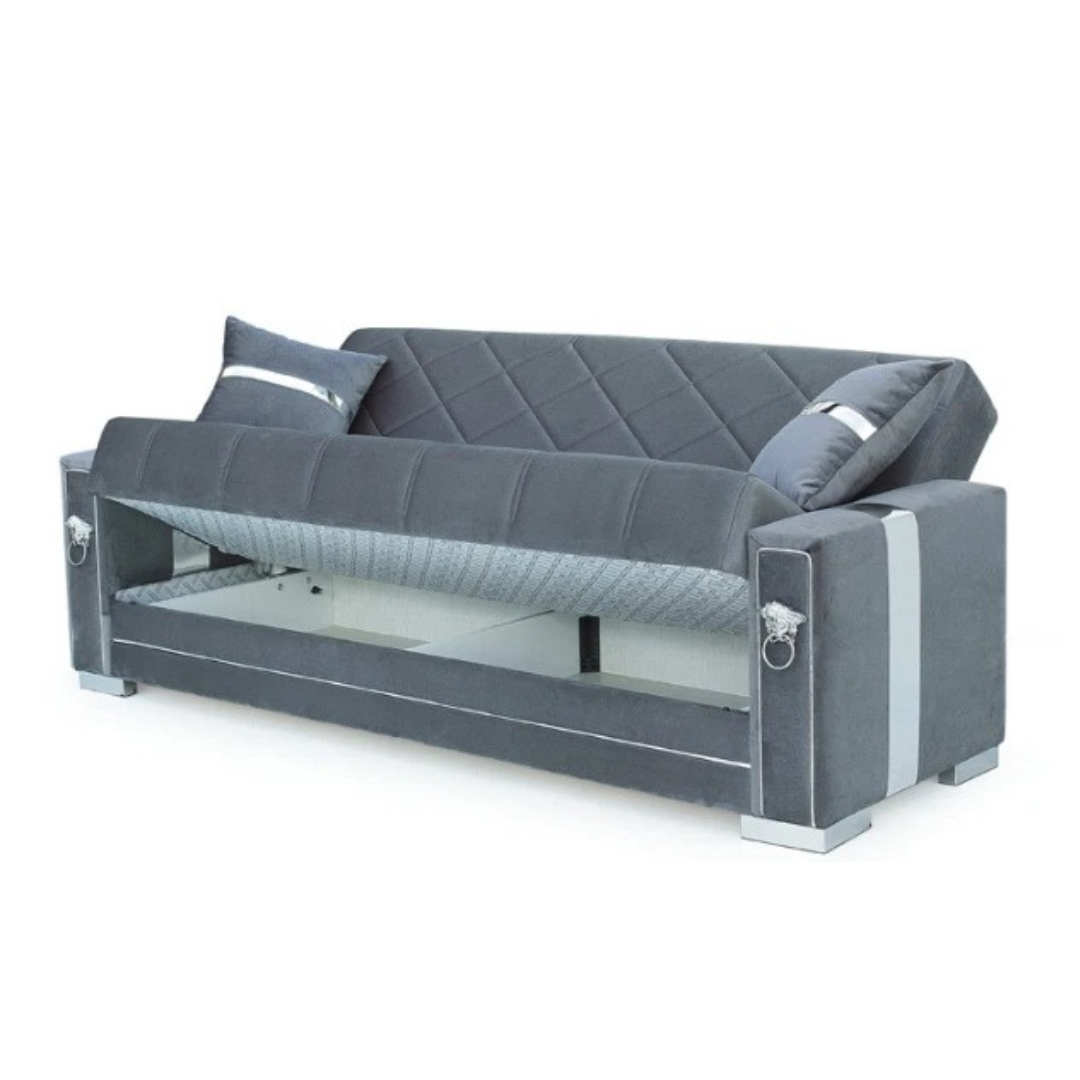 The convenient and spacious hidden storage compartment of the sofa bed with storage, with the lid lifted to reveal a space for cushions and bedding.