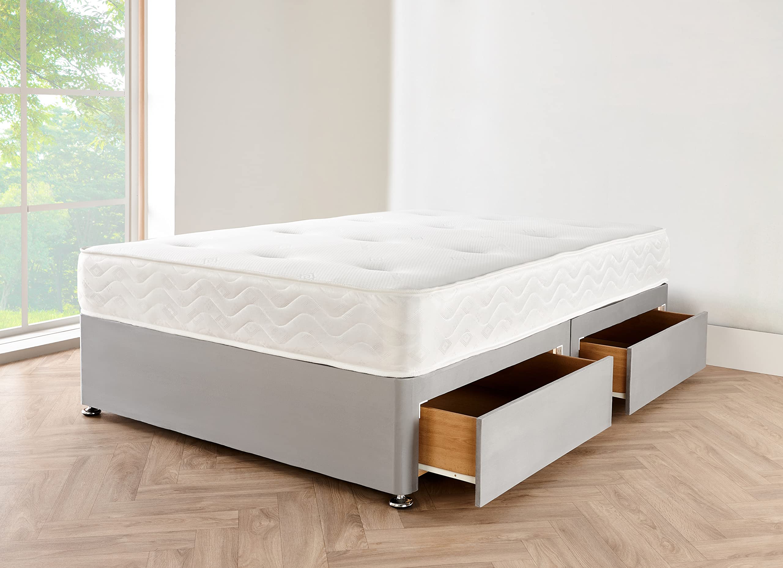 A luxurious grey suede divan bed with a cube headboard and an orthopaedic mattress in a modern bedroom.