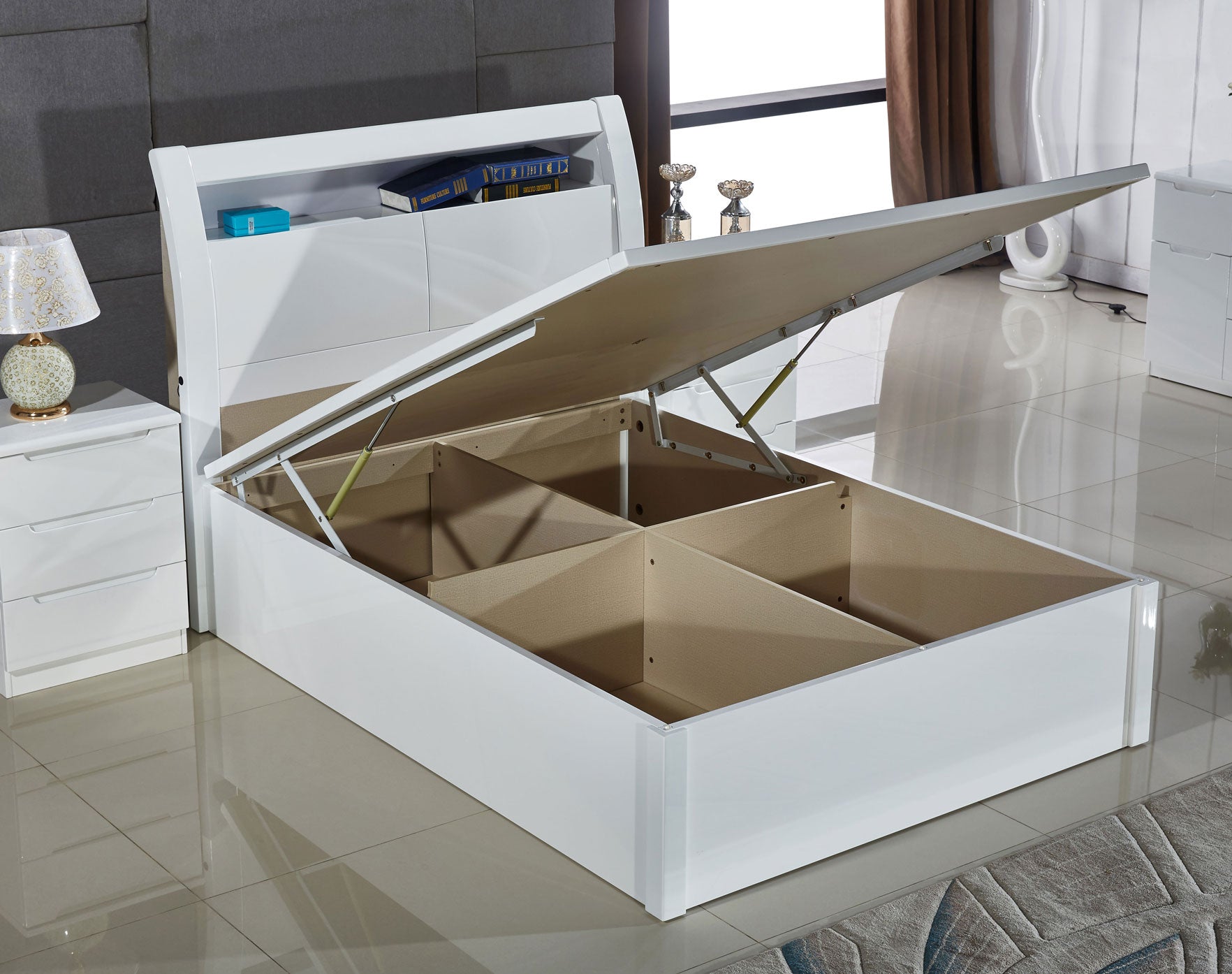 The sleek high-gloss white wardrobe with mirror doors and the matching dressing table, part of the double bed with wardrobe set.